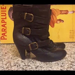 Black heeled buckled booties